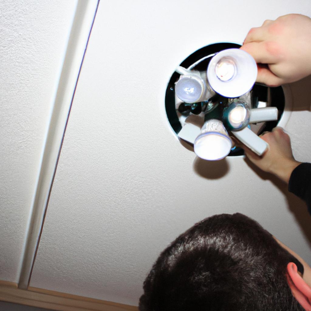 Person installing energy efficient lights